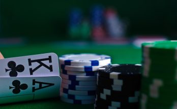 Close-up of poker cards with chips in a casino setting