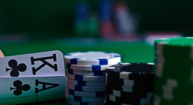Close-up of poker cards with chips in a casino setting